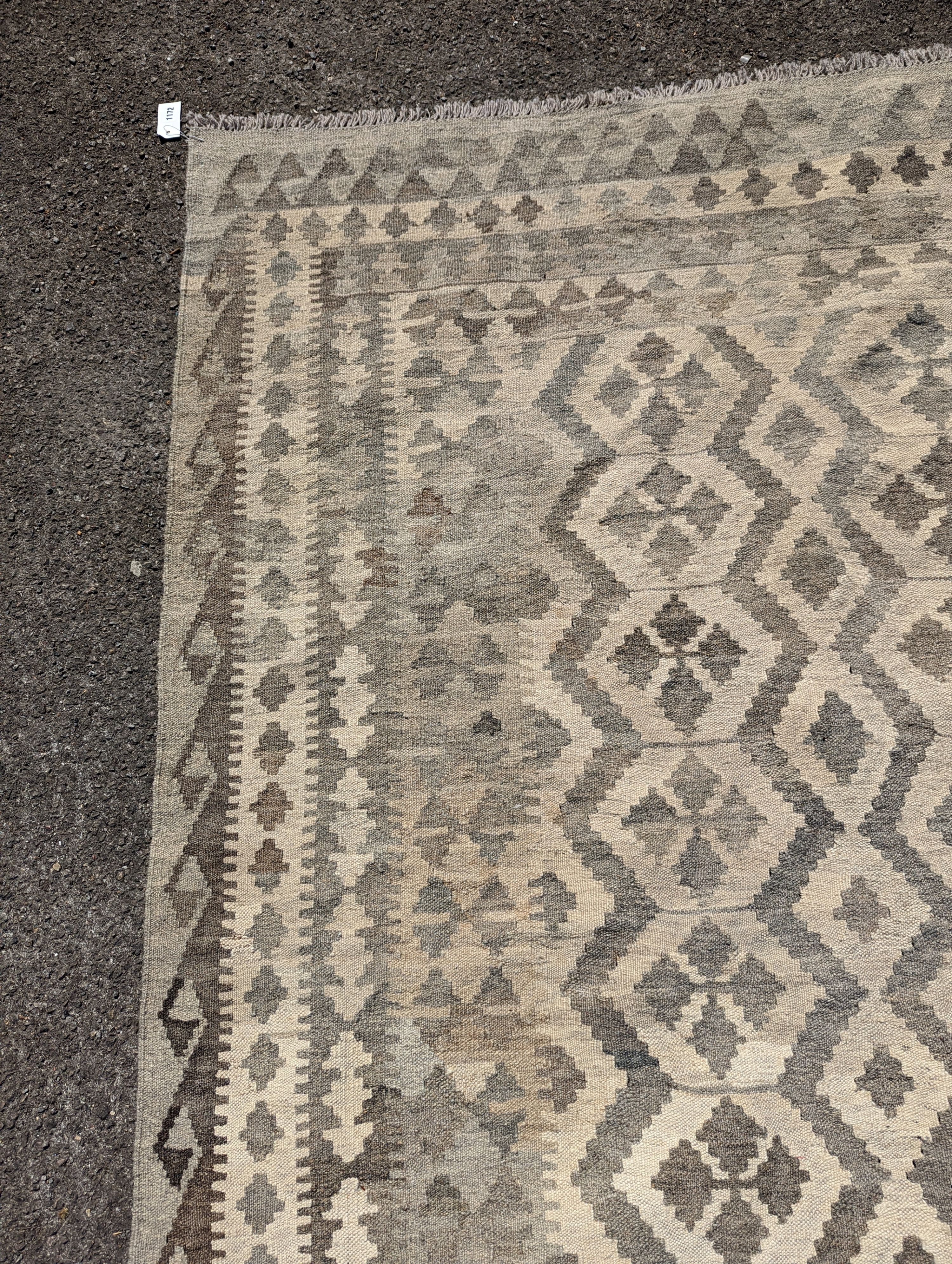 An Anatolian monochrome geometric flatweave carpet, 230 x 175cm